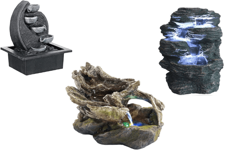 Drei Zimmerbrunnen stehen nebeneinander vor einem weißen Hintergrund